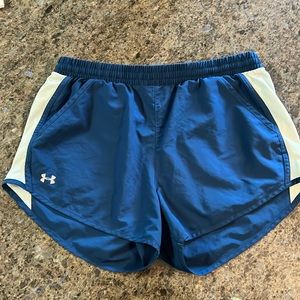Womens Under Armour running shorts.  Size Medium no liner. Navy Blue and white.